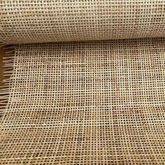 a roll of jute fabric on top of a wooden table