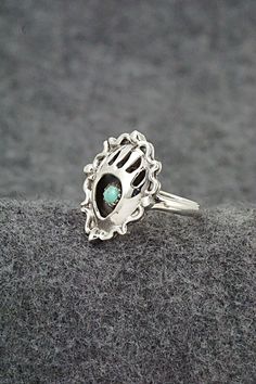 This turquoise and sterling silver bear claw themed ring was made by Navajo silversmith Betty Hawthorne.Size: 6Length: 7/8"Width: 3/4"Free shipping on all orders! We ship with USPS and always include tracking. All orders ship within a day of payment.Returns are accepted up to 30 days after you receive your order. Just send us a message. Our shop offers cash back or store credit. The item must be returned in new condition. Adjustable Southwestern Sterling Silver Turquoise Ring, Sterling Silver Turquoise Ring, Perfect As A Gift, Sterling Silver Rings Turquoise Native American, Nickel-free Round Southwestern Turquoise Ring, Silver Bear, Bear Claw, Instagram Jewelry, Bear Carving, Adjustable Southwestern Turquoise Ring Nickel-free