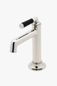 a chrome faucet with a black handle