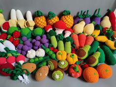 crocheted fruits and vegetables are displayed together