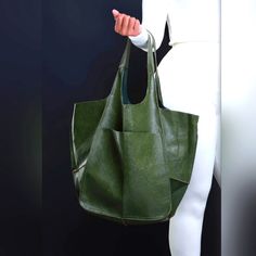 Soft Oversized Green Leather Bag Chic Large Satchel For Errands, Chic Bucket Tote Bag With Pockets, Chic Bucket Bag Tote With Pockets, Chic Large Satchel For Everyday Use, Chic Large Bag For Errands, Chic Large Shoulder Bag For Errands, Everyday Faux Leather Bags With Pockets, Trendy Large Satchel With Large Capacity, Chic Large Everyday Satchel