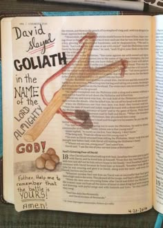 an open bible with the words goliath in it and some nuts on top