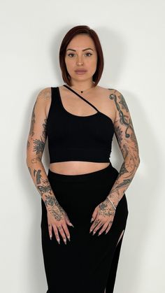 No bra? No problem Another must have to your closet for a basic black top that's an easy go to option for any outfit Wear it with both straps on one shoulder or as a regular tank Fit: True to size Model is: Height: 5'6" Waist: 25” Hips: 31.5" Chest: 32A Wearing size S/M Model is: Height: 5’8” Waist: 32” Hips: 42” Chest: 36.5” (34C) Wearing size M/L Material: 92% NYLON 8% SPANDEX BB724-BC2112 Trendy Stretch Off-shoulder Tank Top, Trendy Off-shoulder Stretch Tank Top, Black Off-shoulder Tank Top For Spring, Spring Black Off-shoulder Tank Top, Trendy One Shoulder Stretch Tank Top, Trendy Stretch One-shoulder Tank Top, Black Off-shoulder Fitted Tank Top, Stretch One Shoulder Top With Built-in Bra, Stretch One-shoulder Top With Built-in Bra