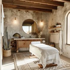 a spa room with a large mirror and white towels on the table in front of it