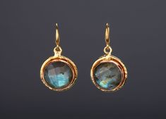 This pair of large genuine labradorite earrings would be a nice reward for yourself or a great gift for your mother or best friend.  1. Stone : labradorite  (natural gemstone) with mesmerizing rainbow glow 2. Stone shape and size:      round / spherical ; 17 mm in diameter     bezel base: 20 mm 3. earring total length ~ 37 mm 4. bezel material: gold plated 5. earring hook: gold plated 6. an optional custom jewelry card printed with your own message, if you are sending these as a gift. Earrings i Round Labradorite Gemstone Earrings, Elegant Nickel-free Labradorite Earrings, Elegant Labradorite Jewelry For Pierced Ears, Elegant Labradorite Drop Earrings, Labradorite Earrings For Pierced Ears As Gift, Adjustable Round Labradorite Earrings, Labradorite Earrings For Gift, Elegant Handmade Labradorite Earrings, Elegant Adjustable Labradorite Earrings