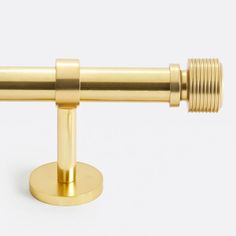 an image of a gold telescope on a white background