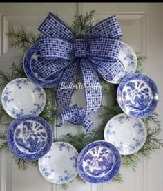 a wreath with blue and white plates on it