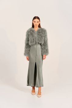 The perfect blend of strong shoulder structure and flattering feminine cropped length, the Marabou feather jacket oozes sophistication and style. Perfect for a chilly winter’s evening, the Manhattan can be dressed up or down no matter the occasion. 100% Marabou Feather outer Satin finish lining Hook and eye clasps at c Chic Cropped Jacket With Faux Fur Trim, Glamorous Winter Outerwear With Feather Trim, Luxury Cropped Winter Outerwear, Cropped Evening Outerwear For Fall, Elegant Faux Fur Outerwear With Feather Trim, Elegant Winter Fur Coat With Feather Trim, Cropped Winter Outerwear For Night Out, Cropped Outerwear For Night Out In Winter, Elegant Outerwear With Faux Fur Trim For Party