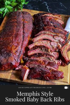 sliced ribs on a cutting board with a knife and parsley next to it, ready to be cooked