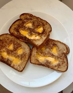 three pieces of toast with cheese on them