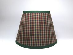 a green and red plaid lamp shade on a white background