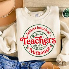 Jolliest Bunch Of Teachers Sweatshirt, Christmas Teacher Gift, Teachers Nuthouse Sweater, Teacher Appreciation, Xmas Teacher Crewneck ✨ Thank you for shopping! BEST WAY TO ORDER 1. Select the size(Please make sure to check our size chart) 2. Select the color 3.Add a note to seller when checking out with any special requests PRODUCT DETAILS: Poly-Cotton Blend Warm and cozy Fits true to size For an oversized look, we recommend ordering up a size or two depending on how big you like it! Sweatshirts are sourced from various brands, such as Gildan, Jerzees, Rustic United and Hanes. Note that a specific brand cannot be guaranteed. PRINTING STYLE We use DTF printing. This is the best technology at the moment.  CARE INSTRUCTIONS Please wash the item inside out in cold or warm water with delicate c Christmas Gift For Teachers, Christmas Teacher Gift, Jolliest Bunch, Teacher Sweatshirt, Teacher Christmas Gifts, Teacher Tees, Teacher Christmas, Sweatshirt Christmas, Mens Long Sleeve Tee