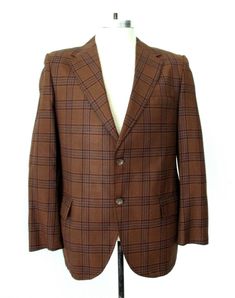 Cool vintage 1960's dark golden brown and blue plaid blazer from Lowell House. Lightweight, nicely soft, feels like great quality worsted wool. Features - two button front - center vent APPROXIMATE MEASUREMENTS in inches - lying flat Size:  Unknown, likely 40 Short Shoulder to shoulder:  17 Sleeve, from shoulder:  23 Chest, armpit to armpit:  21 Waist:  20 Length, center back:  29 CONDITION Vintage blazers have often been altered so exact sizing can be tricky... please double check measurements. Retro Notch Lapel Fall Suits, Retro Notch Lapel Suits For Fall, Vintage Sport Coat With Lapel Collar For Workwear, Vintage Brown Tweed Jacket With Suit Collar, Fall Retro Suits With Notch Lapel, Fall Vintage Semi-formal Suits, Vintage Sport Coat With Welt Pockets For Work, Vintage Tweed Jacket With Suit Collar For Formal Occasions, Vintage Tailored Tweed Jacket For Formal Occasions