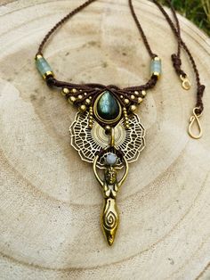 ◈ Bohemian ethnic labradorite necklace ◈ Handmade necklace with the macrame technique. The necklace was made with a labradorite stone and a rainbow moonstone pendant, aventurine heishi beads. brass beads of different shapes, a brass charm and polyester thread. The whole gives a boho, Indian and summer spirit. The necklace is adjustable, worn close to the neck to embellish it. ☯ The jewelry will be packaged with care and shipped as soon as possible Gift Amulet Style Macrame Necklace, Hippie Macrame Choker Necklace, Amulet Style Macrame Necklace Gift, Handmade Moon-shaped Bohemian Necklace, Macrame Pendant Amulet Necklace, Rainbow Moonstone Pendant, Labradorite Necklaces, Koh Tao, Macrame Necklace