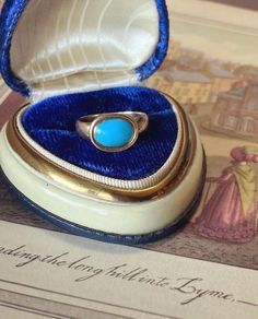 If you are a Jane Austen lover (like me!) or a lover of all things Georgian (also, like me!) then you are sure to swoon over this 'robin egg blue' Persian turquoise solitaire ring that is incredibly similar to Jane Austen's ring housed in Chawton UK, and which was, indeed, made in the same period as hers! Dating from the mid-1770s--the start of the Neoclassical aesthetic in Georgian era design of the 18th century--this ring may be understated in structure but the bright blue of the turquoise packs a striking visual effect.  Jane Austen's ring--pictured as the last picture in this listing for comparison--has become iconic for all Austen devotees and replicas abound.  As a collector myself, this is the only authentic 18th century Georgian ring I have encountered on the public market that res Vintage Oval Turquoise Ring For Formal Events, Vintage Oval Turquoise Ring For Formal Occasions, Antique Oval Turquoise Ring Hallmarked, Classic Turquoise Ring For Formal Occasions, Vintage Turquoise Gemstone Ring For Formal Occasions, Vintage Turquoise Ring For Formal Occasions, Vintage Blue Ring With Bezel Setting, Classic Formal Turquoise Ring, Antique Oval Turquoise Ring