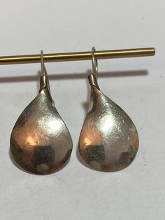 This is a beautiful pair of vintage, handmade, classy, genuine, Taxco sterling silver earrings that have a unique teardrop design. The earrings measure about 1 3/4" by 3/4" at the widest point then narrow at the top to about 3/18" in width. (About 1 1/4" in length without their ear wires). Great everyday earrings. The earrings weigh about 4.6 grams and are stamped TP-20 MEXICO 925, which is the registration number and hallmark of the Taxco artisan who handmade them. Gorgeous and very comfy to we Vintage Silver Drop Jewelry, Formal Teardrop Earrings Stamped 925, Vintage Nickel-free Dangle Teardrop Earrings, Vintage Nickel-free Teardrop Dangle Earrings, Classic Silver Drop Earrings For Pierced Ears, Vintage Teardrop Sterling Silver Jewelry, Classic Silver Teardrop Earrings, Classic Silver Teardrop Earrings Gift, Vintage Nickel-free Teardrop Earrings