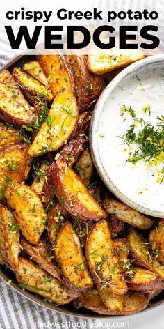 baked mediterranean potato wedges on a plate with ranch dip and sprinkled herbs