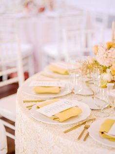 the table is set with place settings and napkins