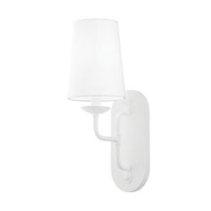 a white wall light with a shade on it