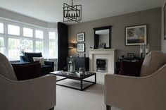 a living room filled with furniture and a fire place