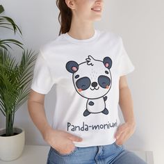 - Embrace the cuteness with this loveable panda t-shirt! - Crafted from soft, breathable fabric for maximum comfort. - Adorable panda graphic on the front adds a touch of charm to any outfit. - Available in sizes ranging from S to 3XL for the perfect fit.  - Whether you're lounging at home or exploring the outdoors, this tee is sure to delight panda lovers of all ages!  .: Made with 100% Airlume combed and ring-spun cotton, a lightweight fabric (4.2 oz/yd² (142 g/m that is easy to layer, breatha Playful Cotton Tops With Bear Print, Cute Short Sleeve T-shirt With Bear Print, Cute Bear Print Short Sleeve Tops, Cute Bear Print Top With Short Sleeves, Cute Bear Print Crew Neck T-shirt, Cute Short Sleeve Tops With Bear Print, Cute Short Sleeve Top With Bear Print, White Cotton Tops With Bear Print, White Short Sleeve Top With Bear Print