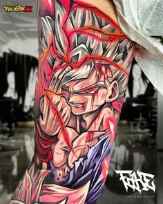 a man's arm with an anime character tattoo on it, and the image of gohan