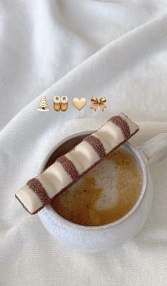 a cup of coffee with some candy in it