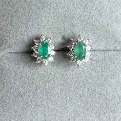 These natural Colombian emeralds are vintage from Colombia.  I repurposed them into stunning earrings.   A 925 sterling silver and white rhodium (platinum) set of oval cut green emeralds with halos of diamonds, all natural.  These earrings are a perfect gift for yourself or someone you love.  Perfect condition.   🎁Gift Box ➡️Color: When looking for emeralds for everyday jewelry, typically below one carat, the color scale ranges from AAA - B. Stones are labeled with these letters based on rarity Classic Green Diamond Earrings, Green Marquise Earrings For Formal Occasions, Fine Jewelry Oval Sterling Silver Earrings, Oval Sterling Silver Earrings Fine Jewelry, Green Marquise Fine Jewelry Earrings, Green Marquise Earrings In Fine Jewelry Style, Fine Jewelry Green Marquise Earrings, Green Marquise Earrings Fine Jewelry, Oval Emerald Earrings For Anniversary