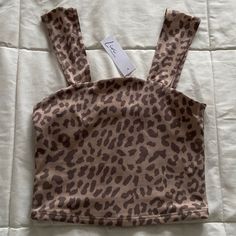 Brown Leopard Print Cropped Seamless Tank Top Size Xs New With Tags/ Never Worn Livi By Olivia Rae Brand Light Brown With Dark Brown Leopard Pattern Soft, Comfortable, And Stretchy Material Thick Straps See Photos For Approximate Measurements Athletic, Athleisure, Activewear, Active, Gym, Workout, Exercise, Sporty, Casual, Lounge, Loungewear, Sporty, Layering Tops, Cropped Tank, Cropped Tube Top, Stretchy Tops, Yoga Brown Seamless Cami Tank Top, Trendy Leopard Print Crop Top, Cheetah Print Crop Top, Layering Tops, Fitted Leopard Print Cami Tank Top, Fitted Sleeveless Leopard Print Crop Top, Black Crop Tee, Purple Crop Top, Slim Fit Crop Top