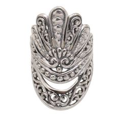 Cast from sterling silver and enhanced with oxidization this generously sized ring from Indonesia's Dwi Adiastuti features traditional Balinese design details such as bun and jawan. The artist adds areas of negative space to further elevate the design which resembles a crown or mask. Antique Silver Rings With Oxidized Finish, Ornate Sterling Silver Filigree Ring With Oxidized Finish, Vintage Silver Filigree Ring With Oxidized Finish, Silver Oxidized Filigree Ring With Ornate Style, Bohemian Antique Silver Sterling Silver Rings, Bohemian Sterling Silver Ring With Oxidized Finish, Bohemian Sterling Silver Rings In Antique Silver, Ornate Adjustable Sterling Silver Rings, Silver Filigree Metal Ring