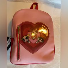 Nwt Powerpuff Girls Backpack. Pink With Gold Tone Hardware. Vinyl Type Material. Zippered Pocket On The Front. Adjustable Back Strap. Carry Handle. Measurements Are Approximate And Pictured. If You Have Any Questions, Please Message Me. Cute Pink Backpack For School Events, Cute Bags With Zipper Closure, Trendy Pink Bag For School Events, Trendy Pink Bags For School Events, Cute Pink Bags For School Events, Pink Cartoon Style Backpack, Pucca Backpack, Sprayground Backpack Powerpuff, Pokemon Pumpkin