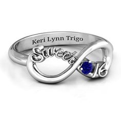 a personalized ring with the name and heart on it