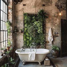 An industrial bathroom with a variety of potted plants and a living wall, adding a pop of green to the neutral space1