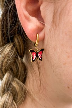 Add a touch of whimsy and color to your ensemble with our 18k Gold Plated Enamel Colored Butterfly Hoop Huggie Earrings! These beautifully crafted earrings feature enamel butterflies in a variety of vibrant colors, perfect for any occasion. Elevate your style and embrace your inner free spirit with these charming earrings! Details:- Huggie-Style Hoops- Dangling Butterfly Charm- 18k Gold Plated- Available in 3 Colors- ImportedDimensions:- 28mm x 18mm Enamel Huggie Jewelry Gift, Trendy Enamel Huggie Earrings, Trendy Hypoallergenic Enamel Earrings, White Enamel Hoop Earrings For Gifts, Butterfly Charm Hoop Jewelry Gift, Black Enamel Hoop Earrings For Gift, Black Enamel Hoop Earrings As Gift, Butterfly Charm Hoop Earrings As Gift, Small Hoop Enamel Earrings For Gift