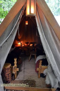 the inside of a tent with lights on