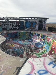 a skateboard park with graffiti all over it