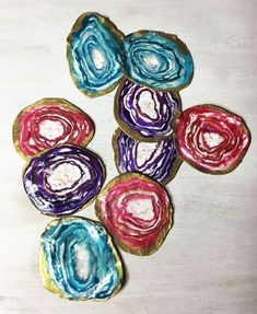 some colorful cookies sitting on top of a table