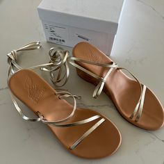 Ancient Greek Sandals Size 39 (Fit Like A Women’s Us 8) Gold Straps With Nude Color Wedge Originally Bought From Saks Never Worn! Original Shoe Box Included Gold Sandals With Wrapped Wedge Heel, Gold Wedge Sandals With Wrapped Heel For Summer, Gold Slides, White Leather Sandals, Sandals Gold, Pink Sandals, Ancient Greek Sandals, Leather Slide Sandals, Leather Sandals Women