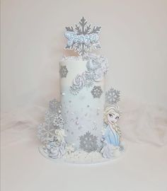 a frozen princess cake with snowflakes on top