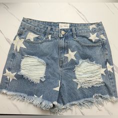 Star Print Denim Shorts Size Small & Medium Available New With Tags. Waist Measurements: S: 28in M: 29in High Waist Fit, Front Inseam Is Approx 11’ Distressed Throughout. Great For Game Days! Trendy Jean Shorts With Star Print For Summer, Trendy Summer Jean Shorts With Star Print, Trendy Jean Shorts With Star Print For Spring, Trendy Star Print Jean Shorts For Spring, High Waist Jean Shorts With Star Print For Summer, Medium Wash Cotton Bottoms With Star Print, Casual Medium Wash Bottoms With Star Print, Summer Denim Shorts With Star Print, Casual Star Print Bottoms In Medium Wash