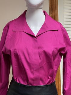 "Beautiful Y2K modern vintage hot fuscia pink shirt / blouse.  Front buttons has chic covering panel.  Three-quarters sleeves with rolled cuffs.  Lovely soft shawl collar with gently pointed tips.  Gorgeous workwear / job interview shirt that looks great as casual wear too! Unisex adult / gender neutral.  💥Condition: Excellent vintage condition.  💥Material: Cotton  Please see measurements before buying.  💥MEASUREMENTS💥 Measurements are taken while the garment is lying flat. Please double where appropriate for actual dimensions. Approximate Measurements (lying flat, buttoned): Width Armpit to Armpit: 20.5\" Width of Bottom Hem: 21\" Length from Shoulder Top to Bottom Hem: 24\" Please be sure the approximate measurements are a good fit for you. We're happy to answer questions or provide Collared Fitted Blouse With Placket, Fitted Collared Blouse With Placket, Fitted Blouse With Buttons And Lapel Collar, Fitted Blouse With Lapel Collar And Buttons, Classic Pink Tops With Collared Neckline, Classic Pink Collared Top, Fitted Solid Color Blouse With Placket, Spring Party Top With Spread Collar, Pink Spread Collar Shirt For Office