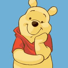 winnie the pooh is standing with his arms crossed