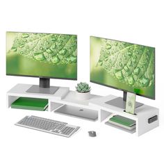 two computer monitors sitting next to each other on top of a white desk with a keyboard and mouse