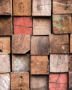 several pieces of wood that are stacked up on top of each other in different colors