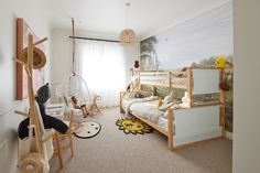 a child's bedroom with bunk beds and toys