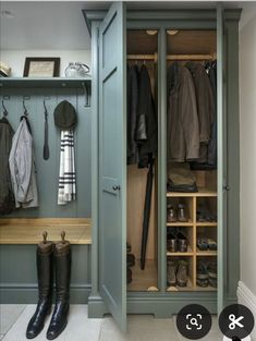 an image of a walk in closet with shoes and umbrellas on the shelf next to it