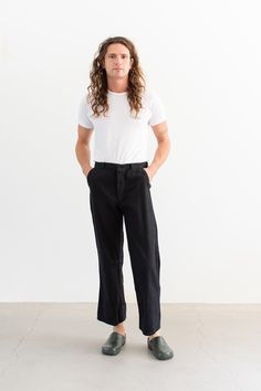 These workwear cotton twill pants feature the following: button fly, high rise, belt loops, front pockets, right back pocket. Straight slim leg. These were originally white workwear chinos, now dyed black. Unisex Fit so the hips are more narrow than modern women's pants.  Material: 100% Cotton Twill lightweight | Made in the USA in the 60s. Garment Dyed in Los Angeles in 2022. Condition: Great. A couple small variations in dye   Measurements: 33" Waist / 39" Hips / 11.25" Rise / 12" Thigh / 9" Leg Opening / 29.5" Inseam Elijah is 6'0" with a 30" waist. This could fit a larger frame. SHOP http://www.rawsonstudio.etsy.com FOLLOW US + instagram | @_rawson  + pinterest | rawson *No Returns. Items are eligible for store credit only. We ask that the buyer ship to provided address and a credit co Workwear Chinos, Pant Trouser, Utility Pants, Fly High, Twill Pants, Slim Legs, Cotton Twill, Black Cotton, Favorite Outfit