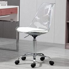 a clear office chair sits in front of a desk with a bookcase on it