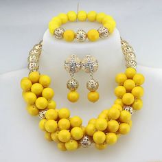 Enhance your bridal look with this classic Nigerian Wedding Bridal Jewelry. The African crystal beads jewelry set adds a touch of elegance and cultural significance to your wedding ensemble, creating a timeless and beautiful look. Elegant Yellow Jewelry Sets For Weddings, Elegant Yellow Jewelry For Marriage, Gold Faceted Beads Jewelry Set For Wedding, Yellow Crystal Necklace For Weddings, Formal Yellow Jewelry With Round Beads, Gold Beaded Bridal Set For Wedding, Hand Set Round Beads Jewelry Sets For Wedding, Crystal Jewelry With Gold Beads For Wedding, Elegant Yellow Jewelry With Round Beads