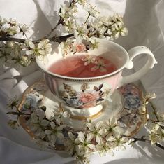 a tea cup and saucer with flowers on it